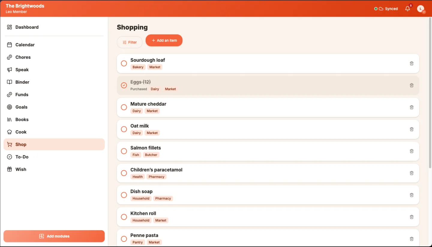 The shopping list on a laptop, with the family's items and their stores.